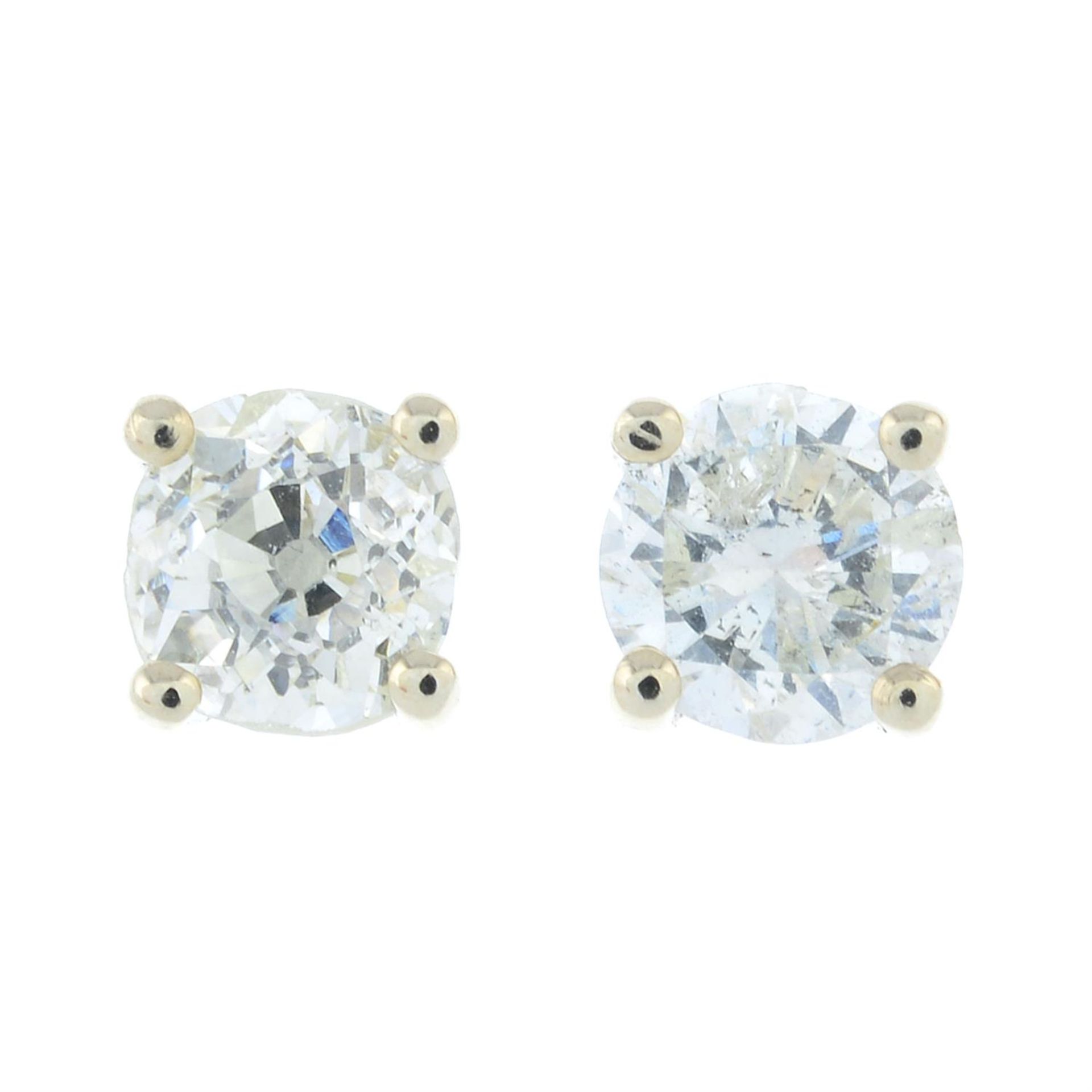 A pair of brilliant-cut diamond single-stone stud earrings.