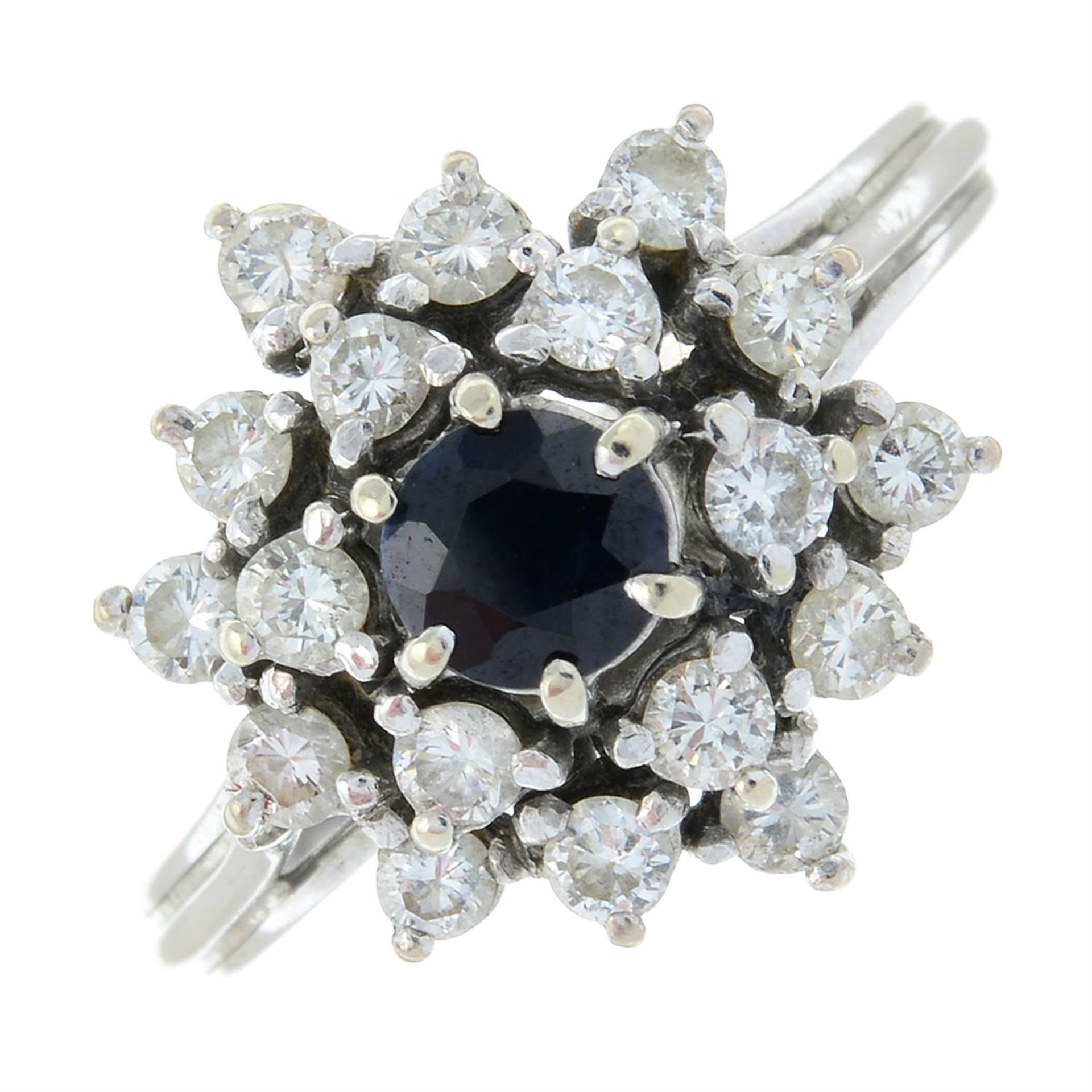 An 18ct gold sapphire and diamond cluster. (
