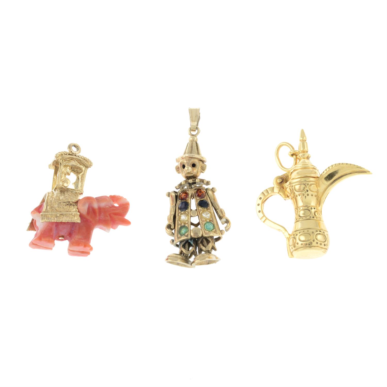 Two 9ct gold gem-set charms and a aftaba charm.