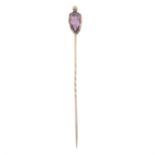 An early to mid 19th century gold pink topaz foil-back stickpin.