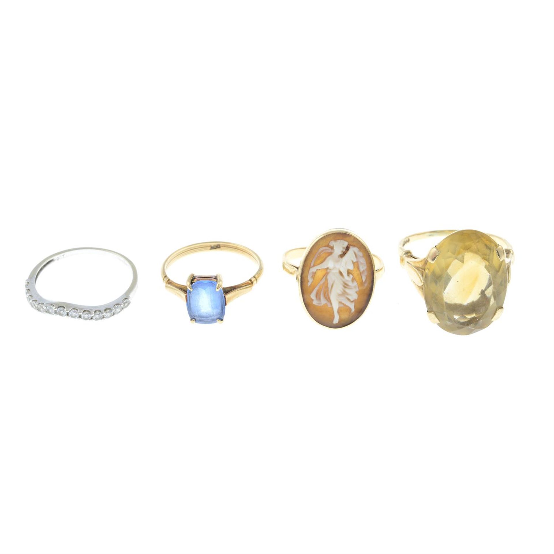 Four gem-set rings.