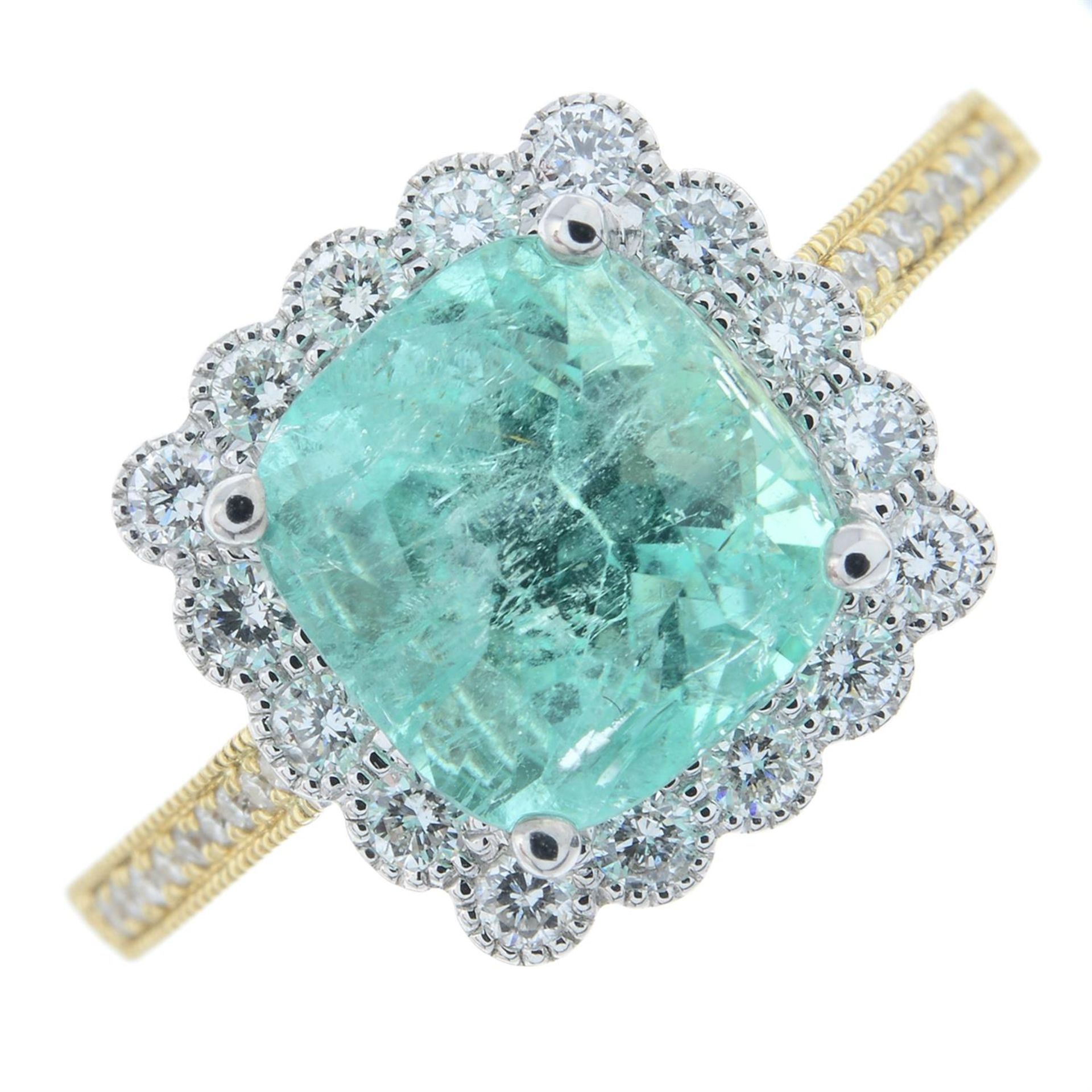 An 18ct gold emerald and diamond cluster ring.