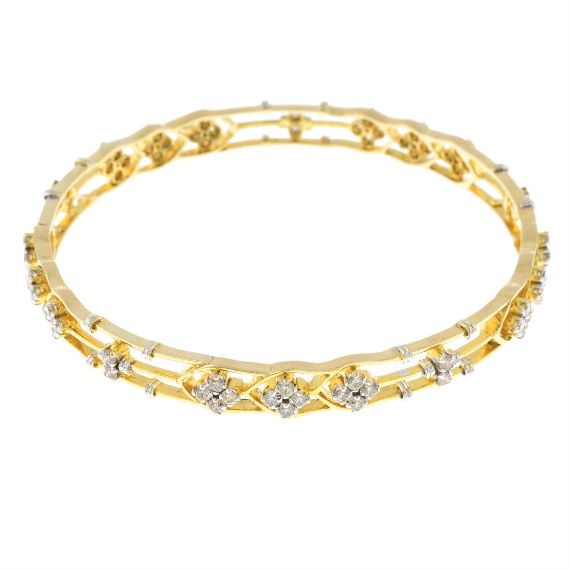 A diamond openwork bangle.