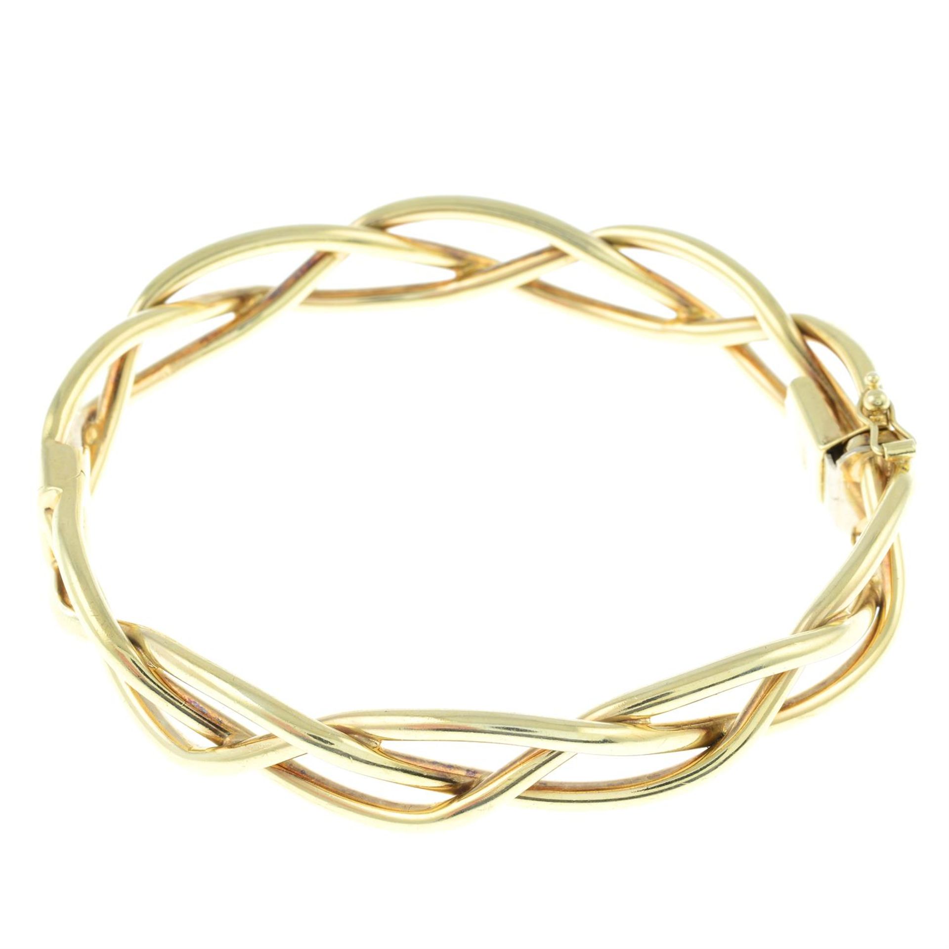 An early to mid 20th century 9ct gold bangle, with star motif. - Image 2 of 2