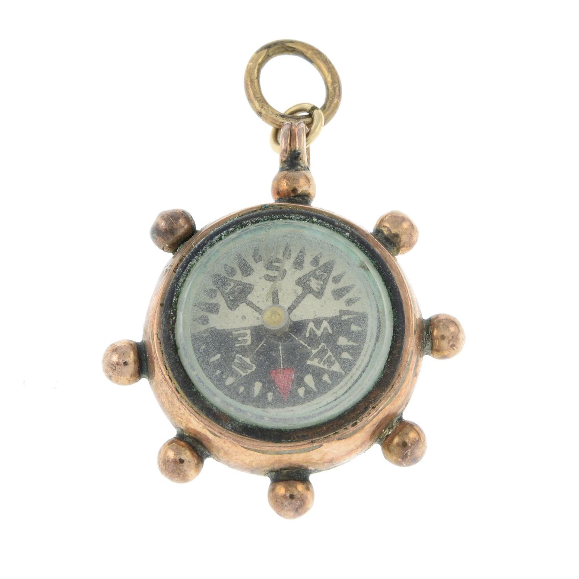 An early to mid 20th century gold bloodstone compass pendant/charm.