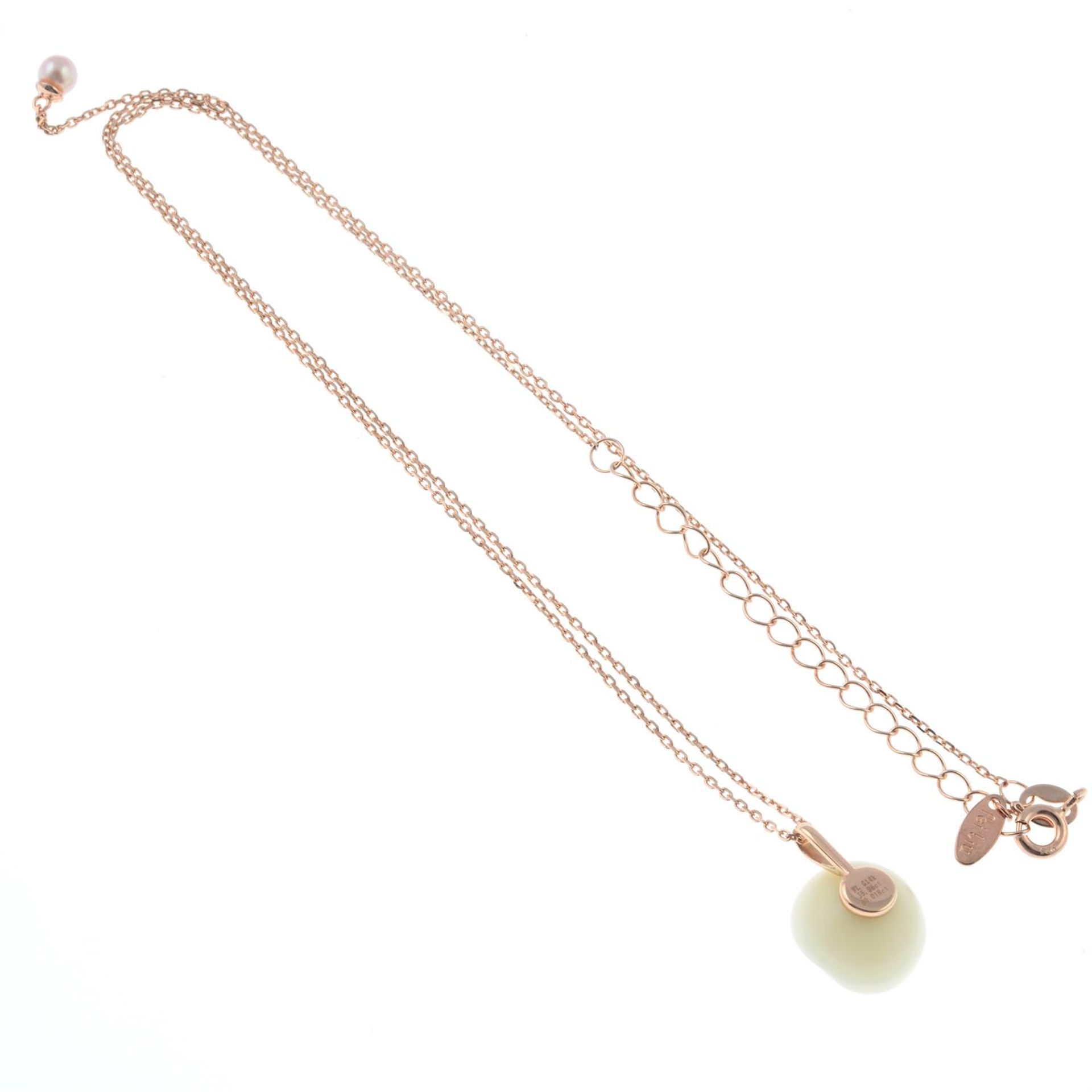 A jade and diamond floral pendant, with chain and free-moving cultured pearl pendant. - Image 2 of 2