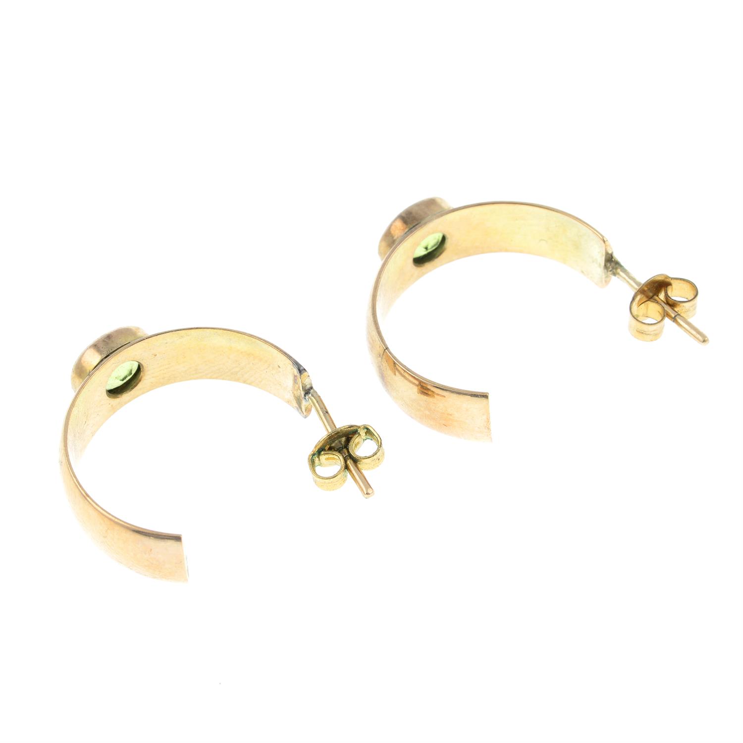 A pair of peridot half hoop earrings. - Image 2 of 2