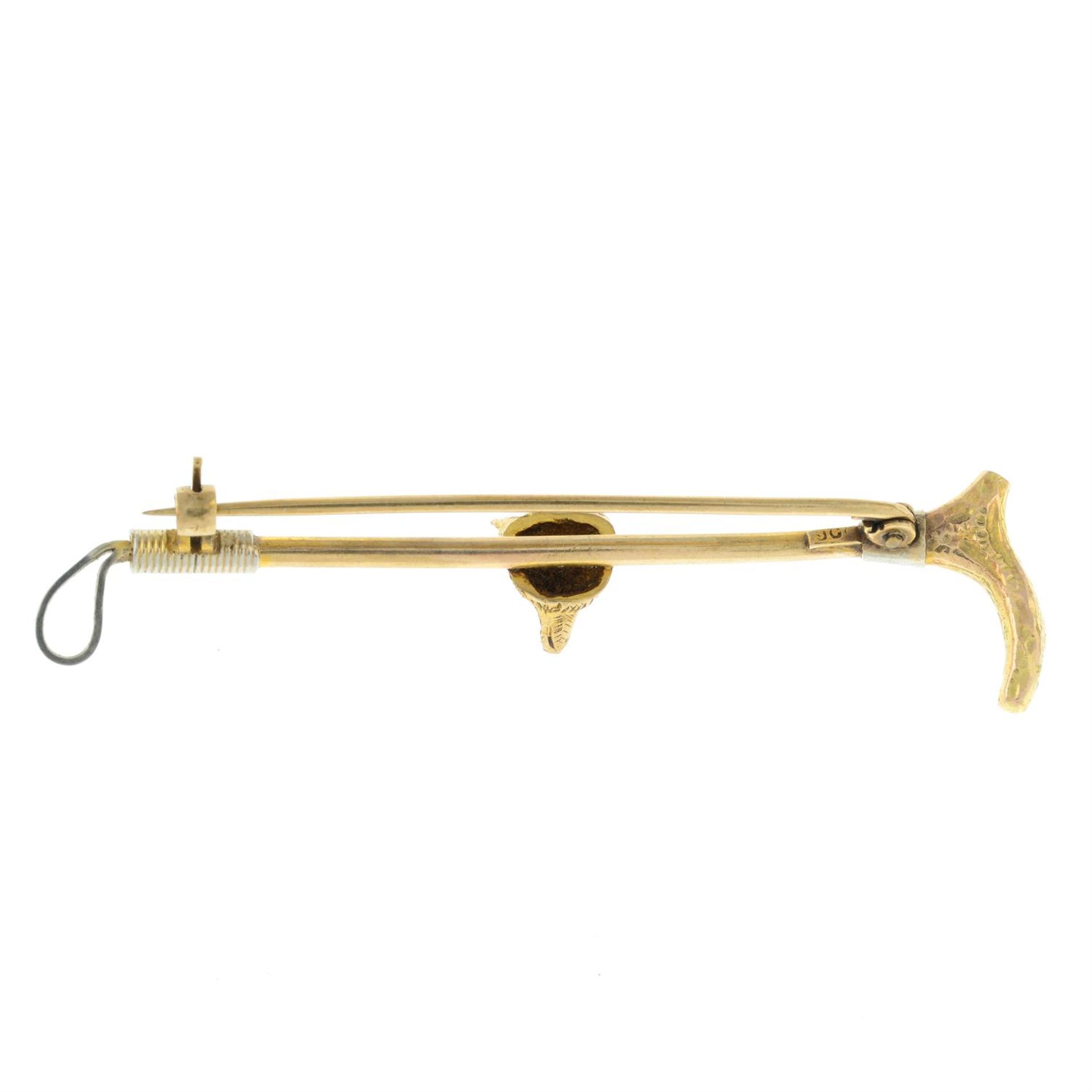 An early 20th century 9ct gold fox head and riding crop bar brooch. - Image 2 of 2