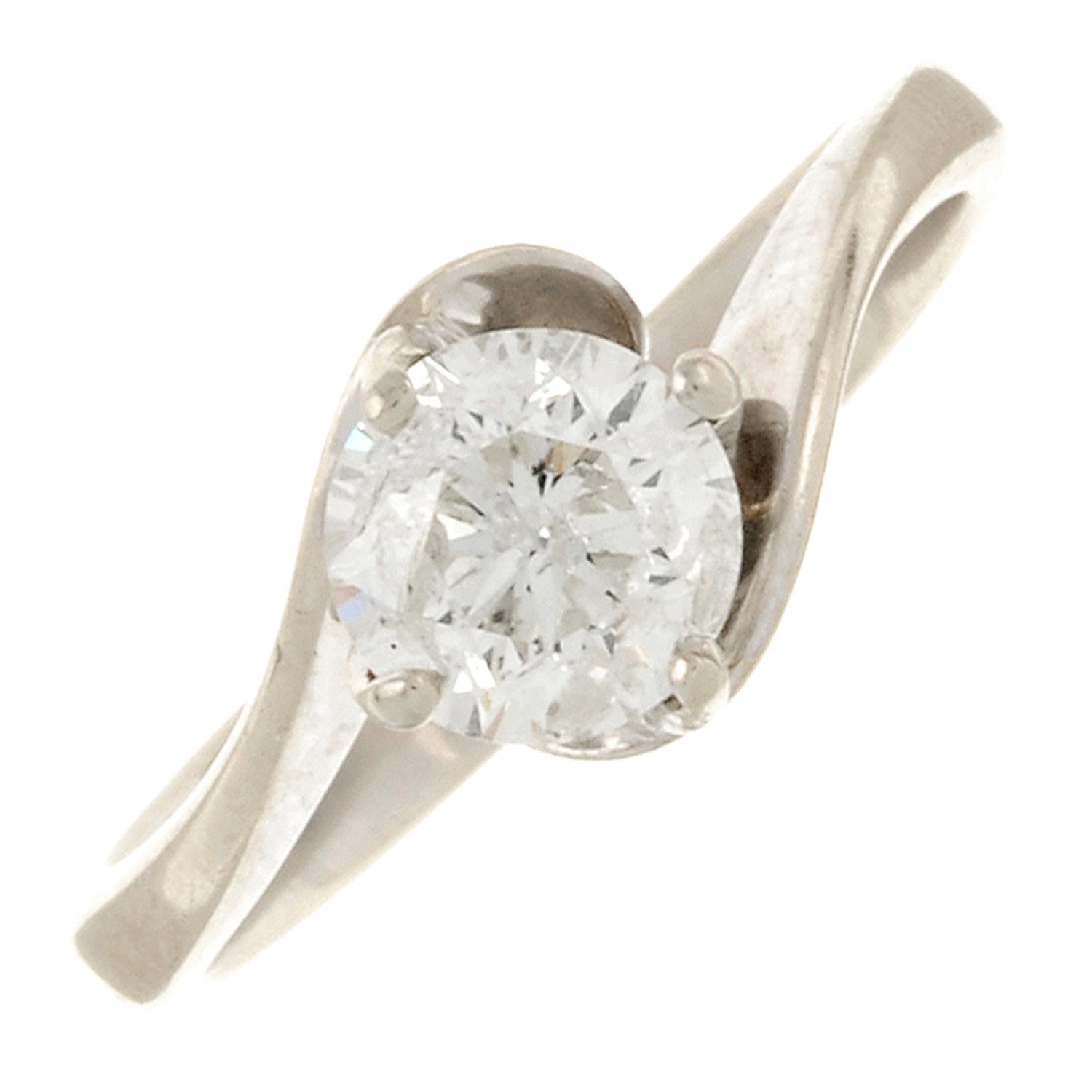 An 18ct gold brilliant-cut diamond single-stone crossover ring.