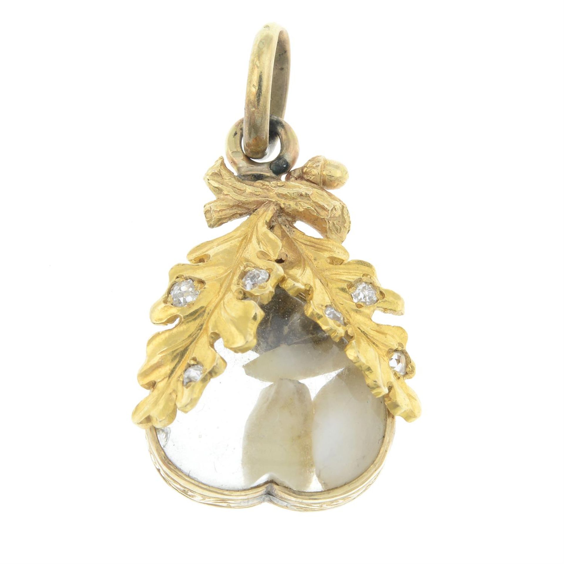 A 19th century gold baby teeth and old-cut diamond oak leaf pendant.