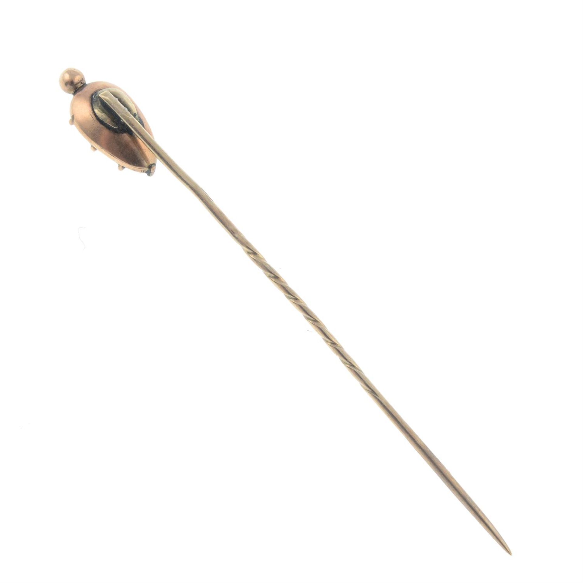 An early to mid 19th century gold pink topaz foil-back stickpin. - Image 2 of 2