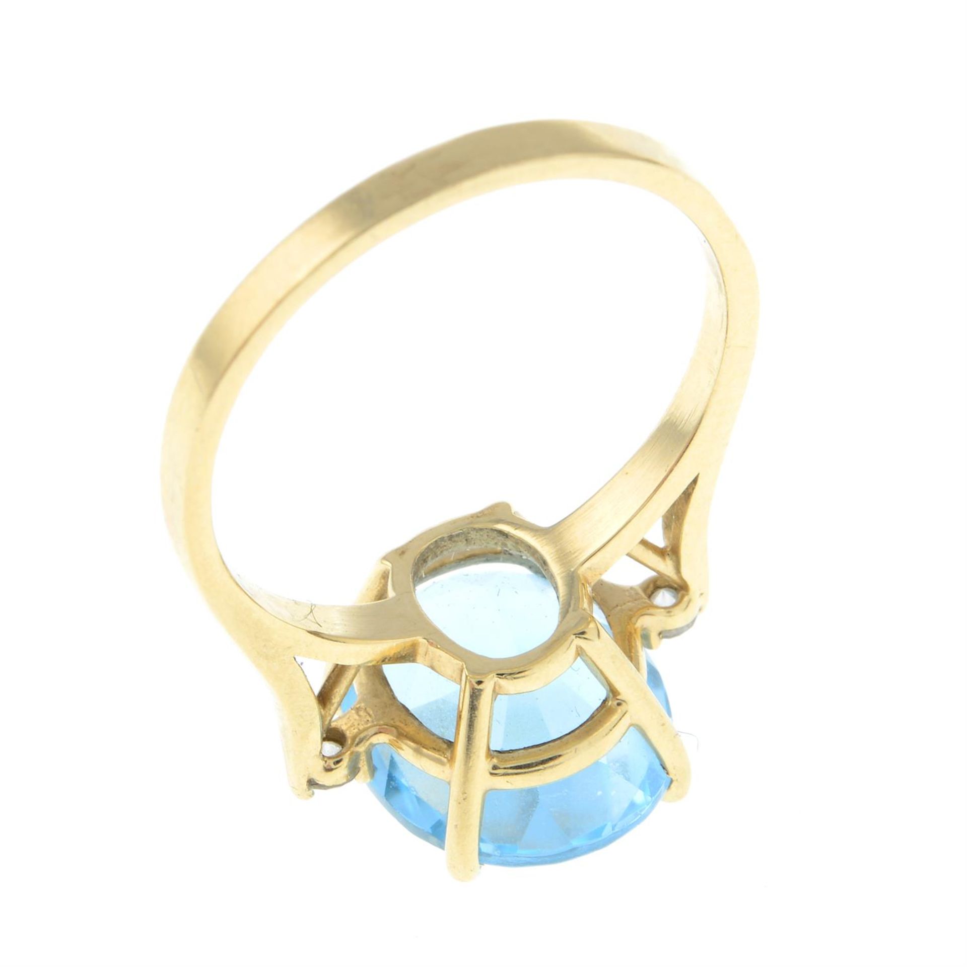 A blue topaz single-stone ring, with diamond accent shoulders. - Image 2 of 2