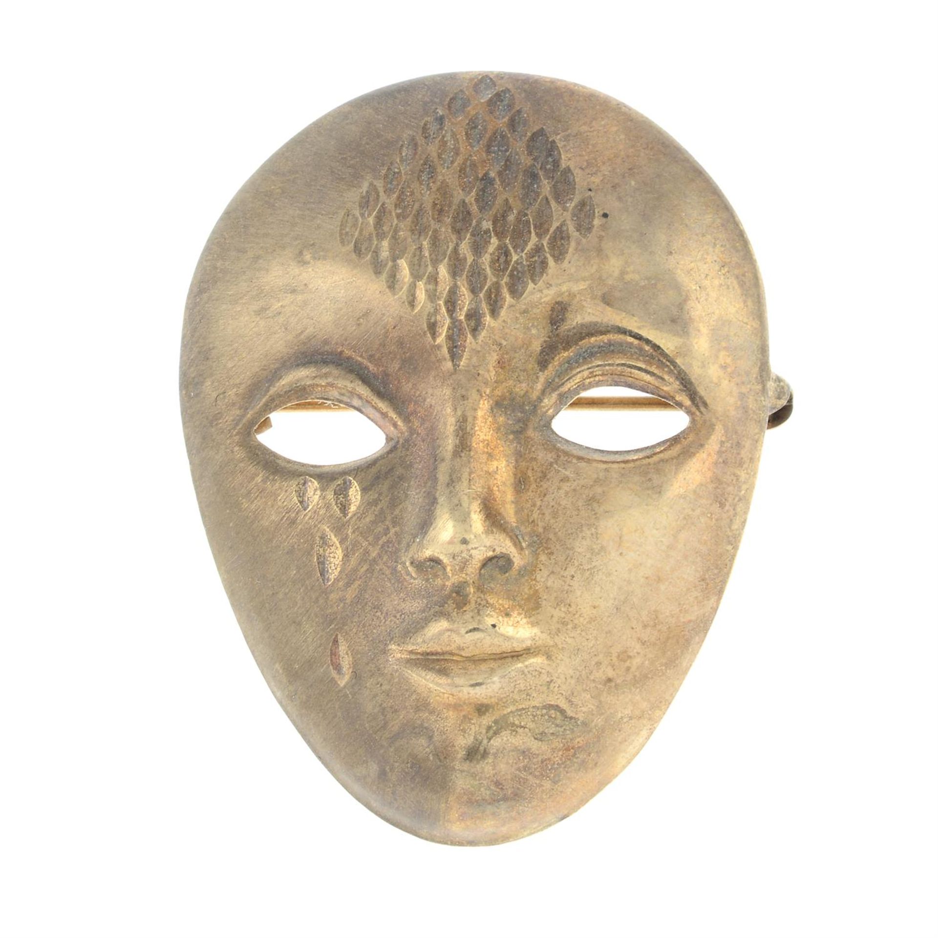 A 9ct gold opera mask brooch.