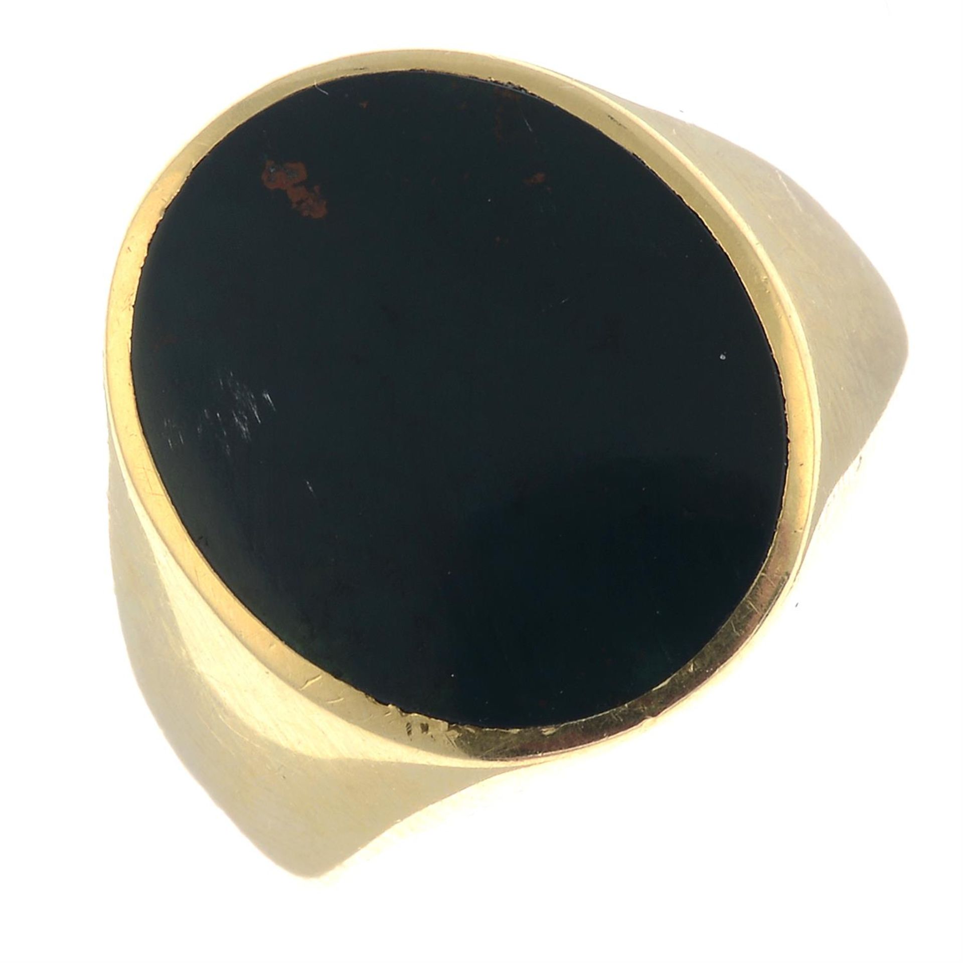 An oval-shape bloodstone signet ring.