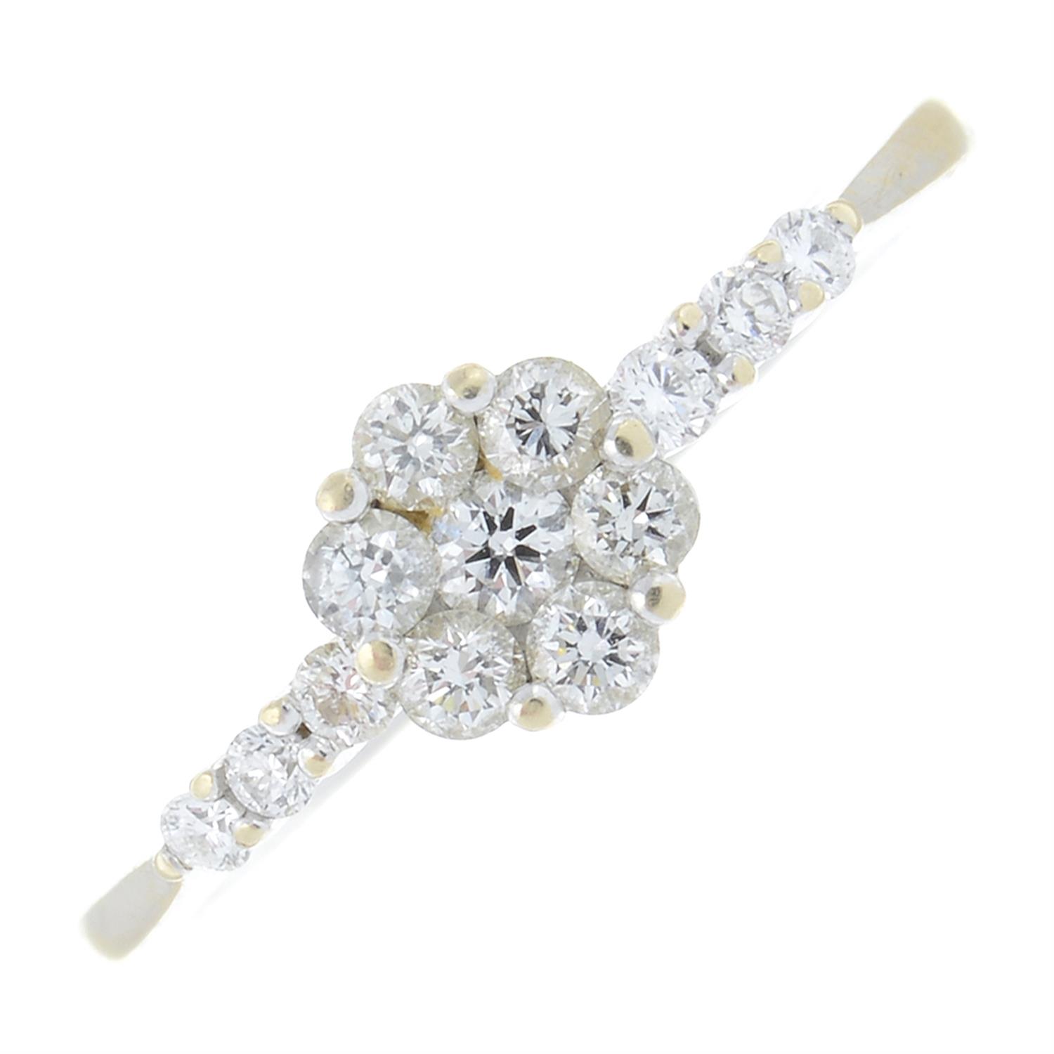 An 18ct gold brilliant-cut diamond floral cluster ring, with diamond shoulders.