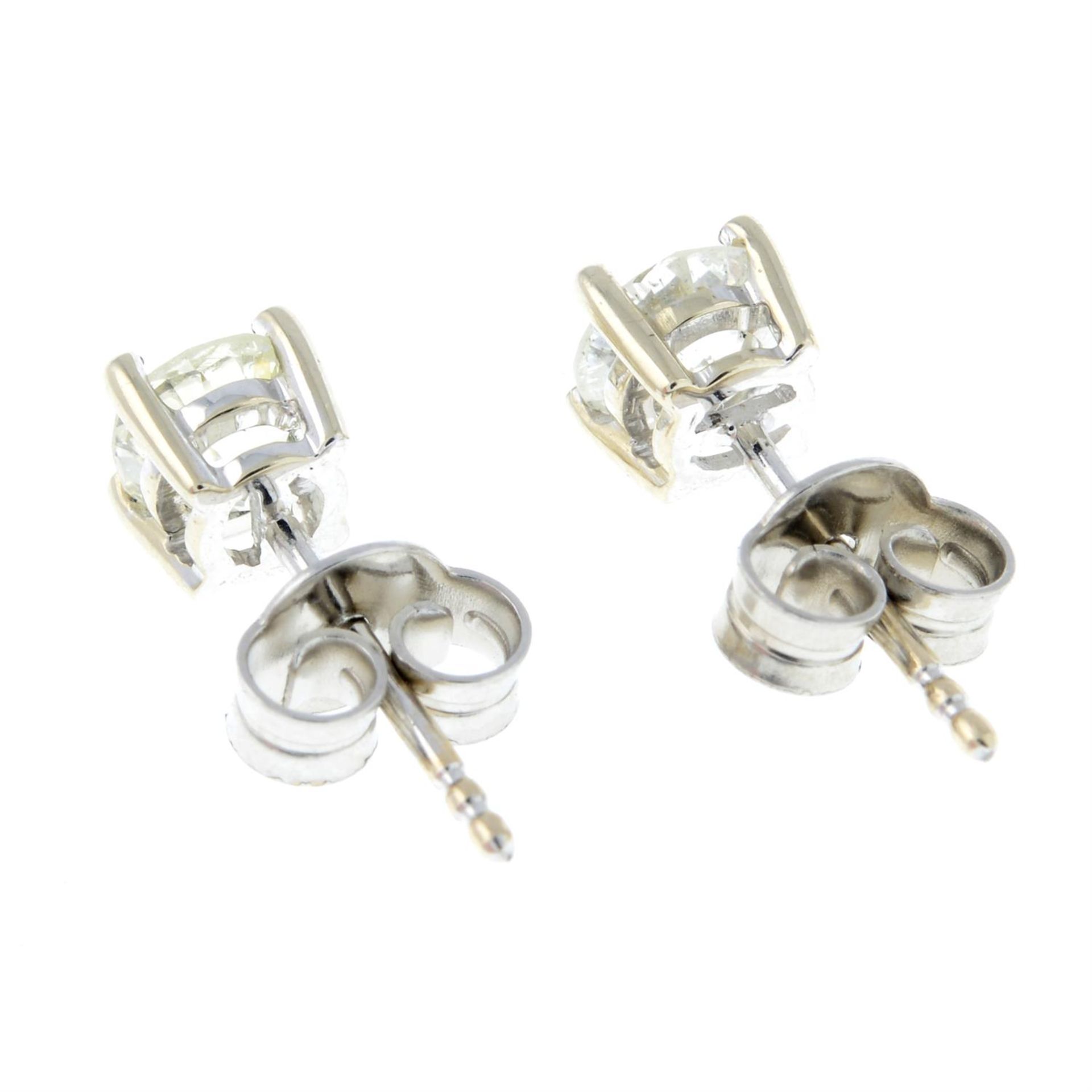 A pair of brilliant-cut diamond single-stone stud earrings. - Image 2 of 2