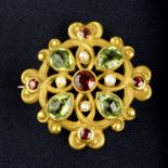 An early 20th century lightly textured 14ct gold garnet, peridot and seed pearl brooch.