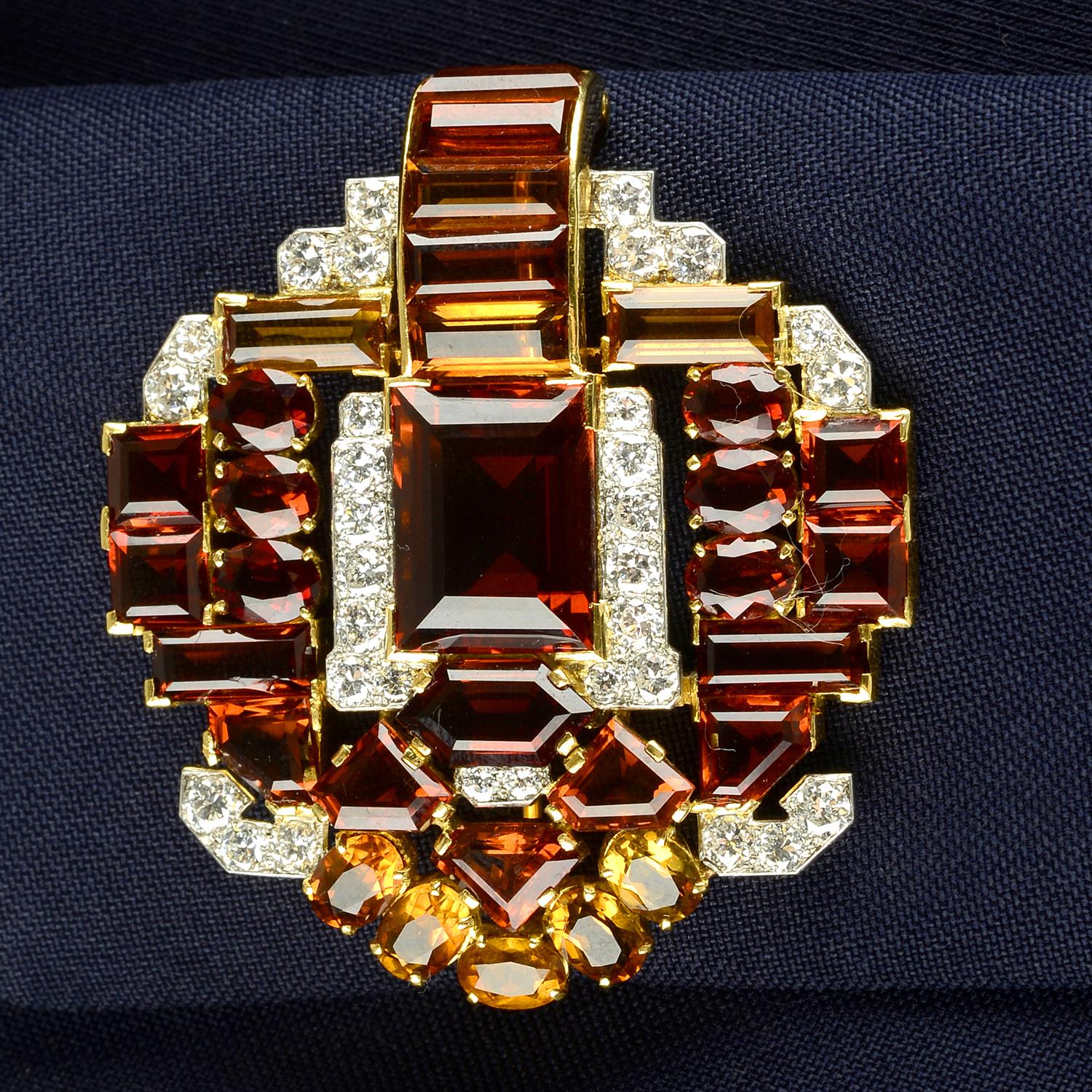 An Art Deco platinum and 18ct gold citrine and circular-cut diamond brooch, attributed to Cartier.