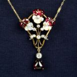 A late 19th century carved moonstone and garnet pansy pendant, with old-cut diamond highlights,