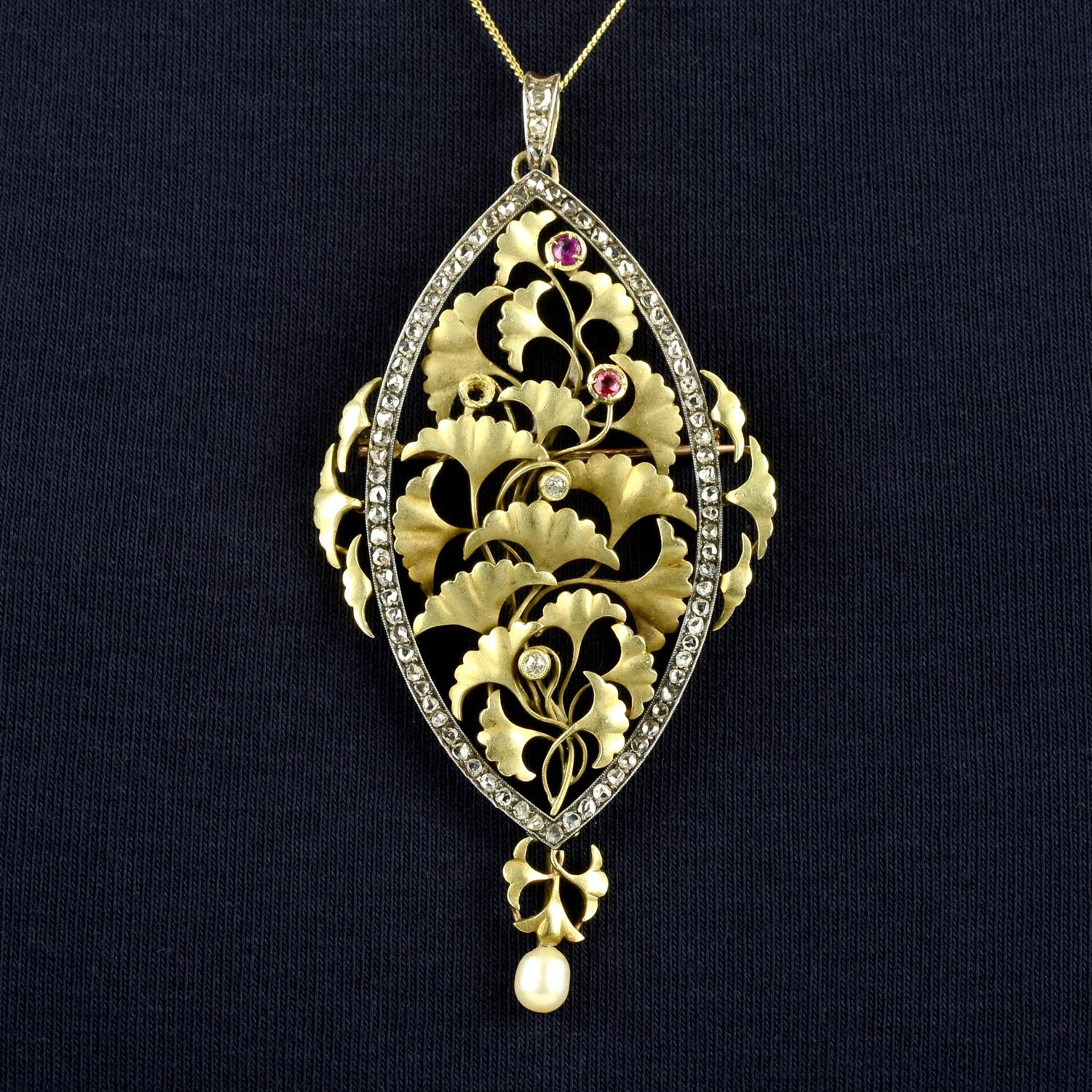 An Art Nouveau silver and gold, vari-cut diamond, ruby and cultured pearl ginkgo leaf