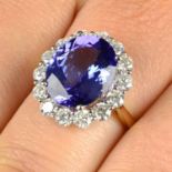 An 18ct gold tanzanite and brilliant-cut diamond cluster ring.