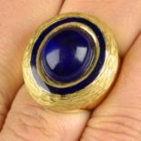 A mid 20th century gold lapis lazuli, blue enamel and textured ring.