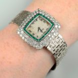 A mid 20th century 18ct gold wrist watch, by Piaget, with calibré-cut emerald and brilliant-cut