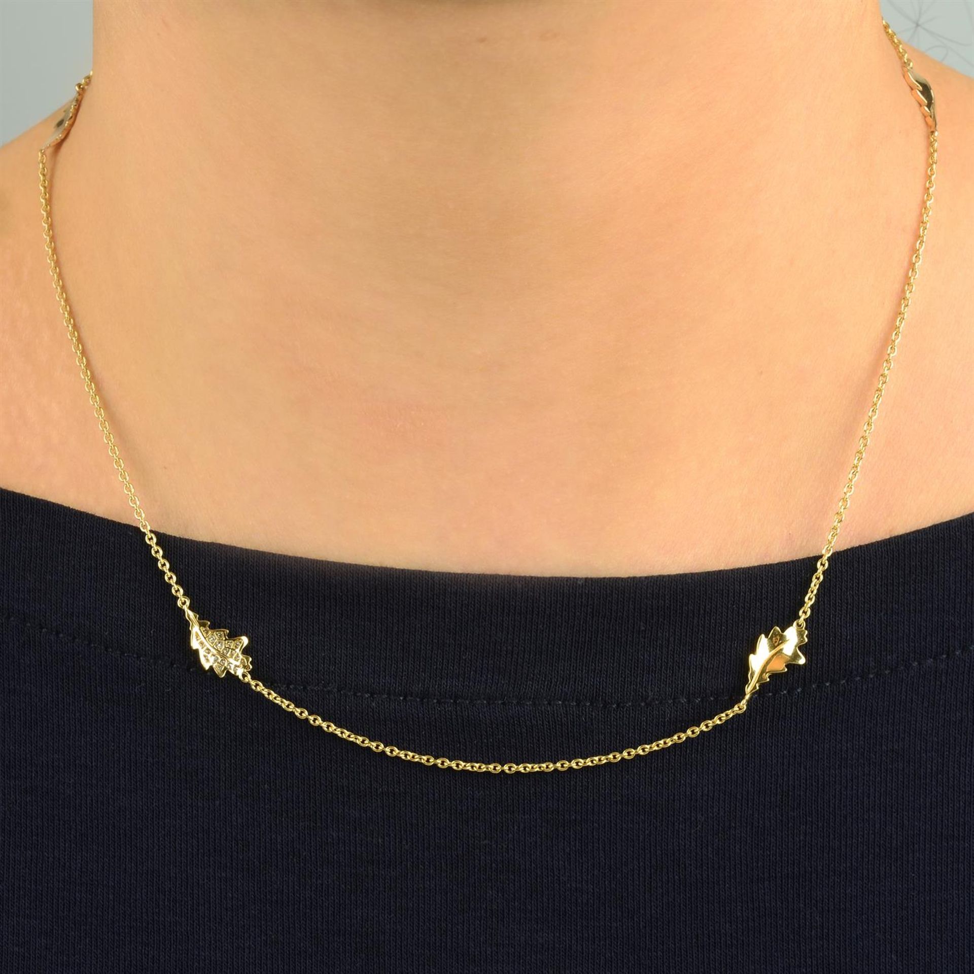 A tri-colour 18ct gold foliate motif necklace, with pavé-set diamond highlight, by Asprey.