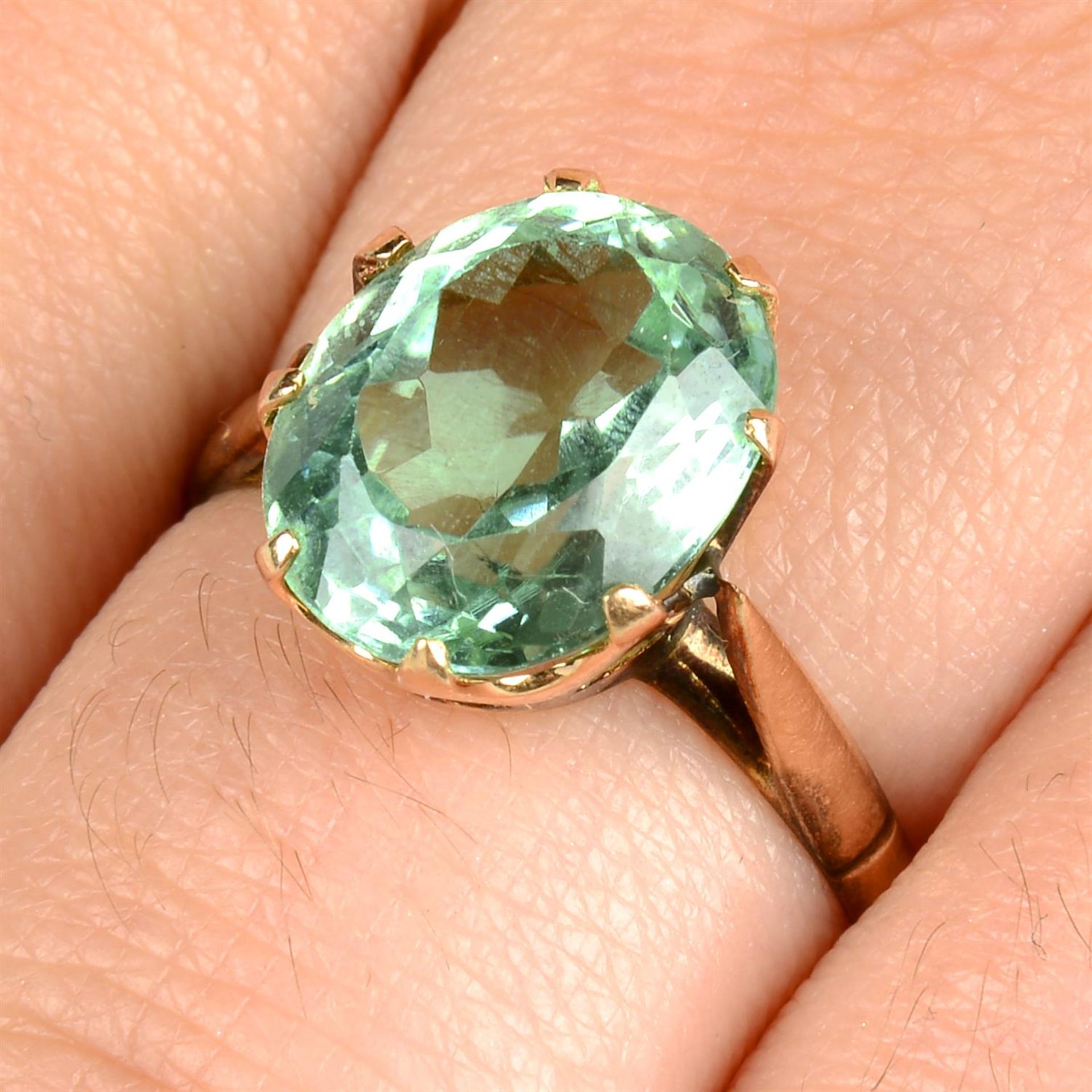 A bluish green tourmaline single-stone ring.