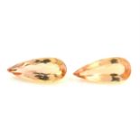 Pair of pear shape imperial topazes, weighing 5.54ct