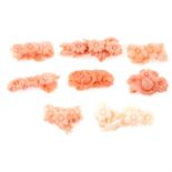 Eight pieces of carved coral featuring flowers, weighing 33grams