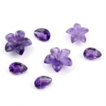 Seventeen carved amethysts and eleven pear shape amethysts, weighing 52.10ct. Featuring flowers.