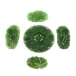 Eight pieces of carved jade featuring chinese characters and floral subjects, weighing 74grams