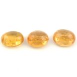 Three oval shape imperial topaz cabochons, weighing 28.97ct