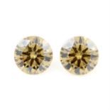 Two circular shape synthetic yellow moissanites, weighing 4.83ct