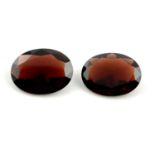 Pair of oval shape garnets, weighing 12.54ct