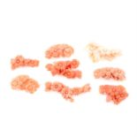 Eight pieces of carved coral featuring flowers, weighing 33grams