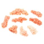 Eight pieces of carved coral featuring flowers, weighing 40grams