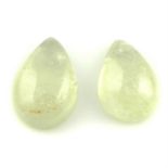 Pair of pear shape sapphire cabochons, weighing 9.57ct