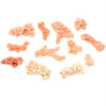 Twelve pieces of carved coral featuring flowers, weighing 47grams