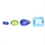 Four gemstones, weighing 20ct .To include a peridot, a kyanite, a topaz and a synthetic bue sapphire