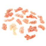 Seventeen pieces of carved coral featuring flowers, weighing 66grams