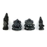 Four carved sapphires, weighing 58.61ct. Featuring Buddha and Ganesha