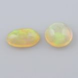 Two vari-shape opal cabochons, weighing 3.53ct