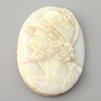 An oval shape opal cameo, weighing 30.10ct. Featuring a man
