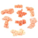 Eight pieces of carved coral featuring flowers, weighing 34grams