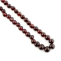 Twenty-five strands of garnet beads, weighing 659grams