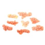 Eight pieces of carved coral featuring flowers, weighing 33grams
