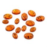 Selection of amber cabochons, weighing 297grams