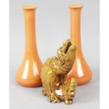 A Burmantofts dragon, together with a pair of Pilkingtons Lancastrian vases.